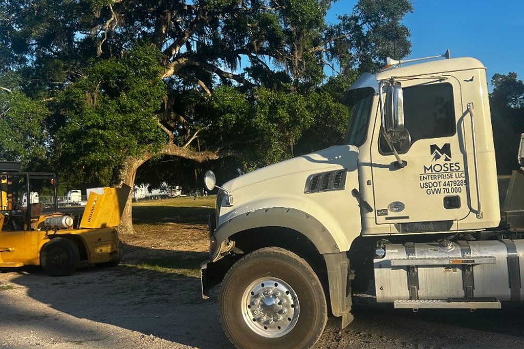 Moses Enterprise LLC Mack truck on a dirt hauling job site