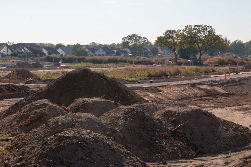 Excavated land and dirt piles on a development site